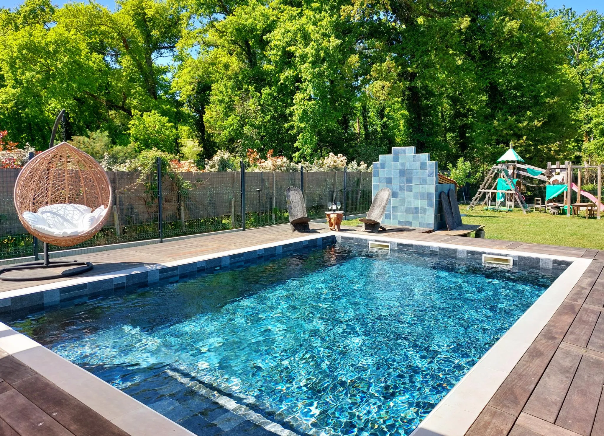 Pool and Garden view with Wooden Castle in the Background